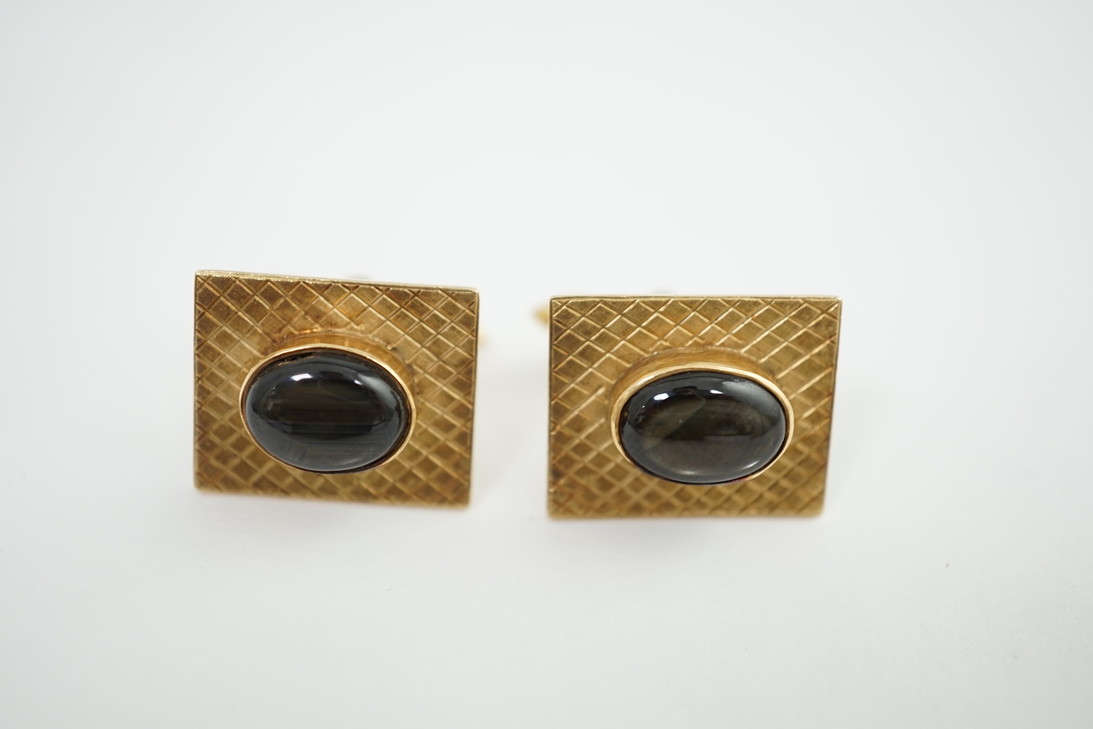 A pair of 18K gold tablet cufflinks, mounted with grey quartz cabochons, in a rubover setting